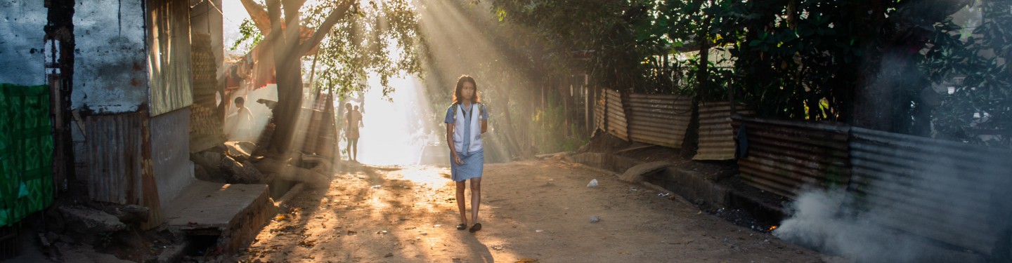 Woman walking on a street in the Philippines