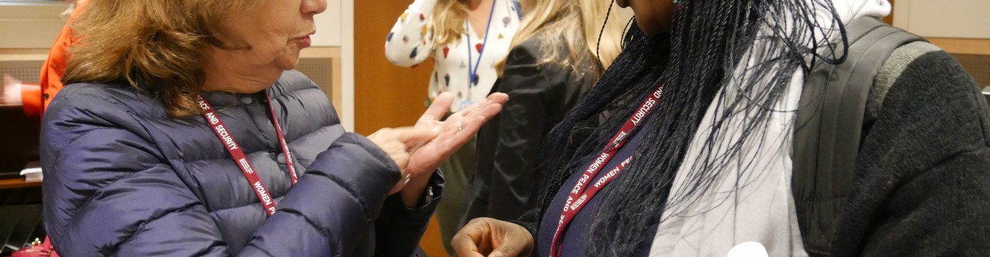 Two woman talking together at the UN