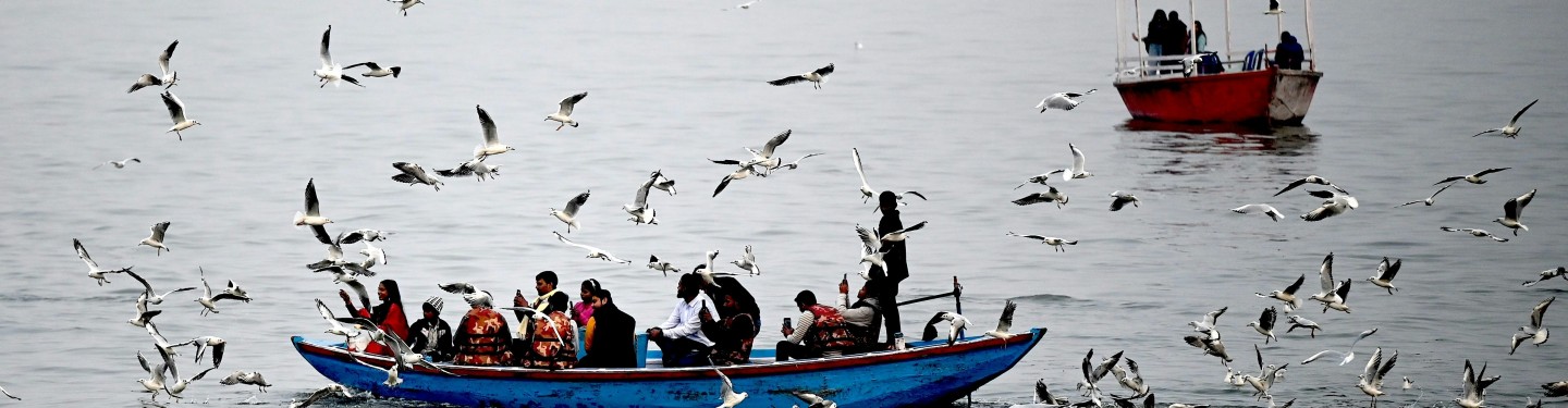 People sitting on a boat in India