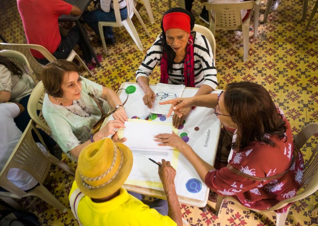 Four people sitting around a table