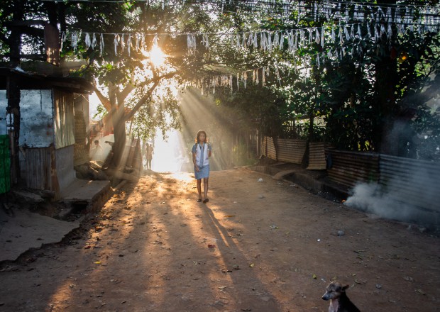 Woman walking on a street in the Philippines