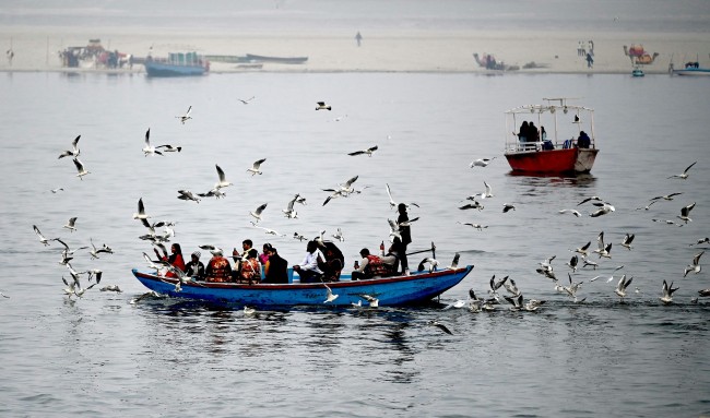 People sitting on a boat in India