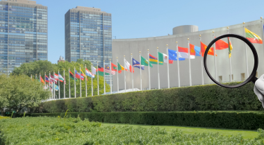 Magnifying glass in front of UN HQ