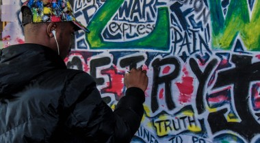 Man painting a wall in Harare